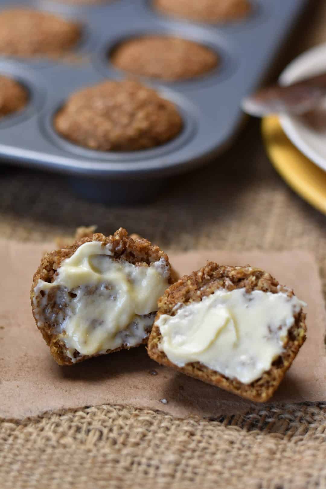 closeup of miniature bran muffins with butter spread