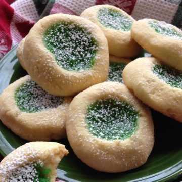 thumbprint cookies on a green plate