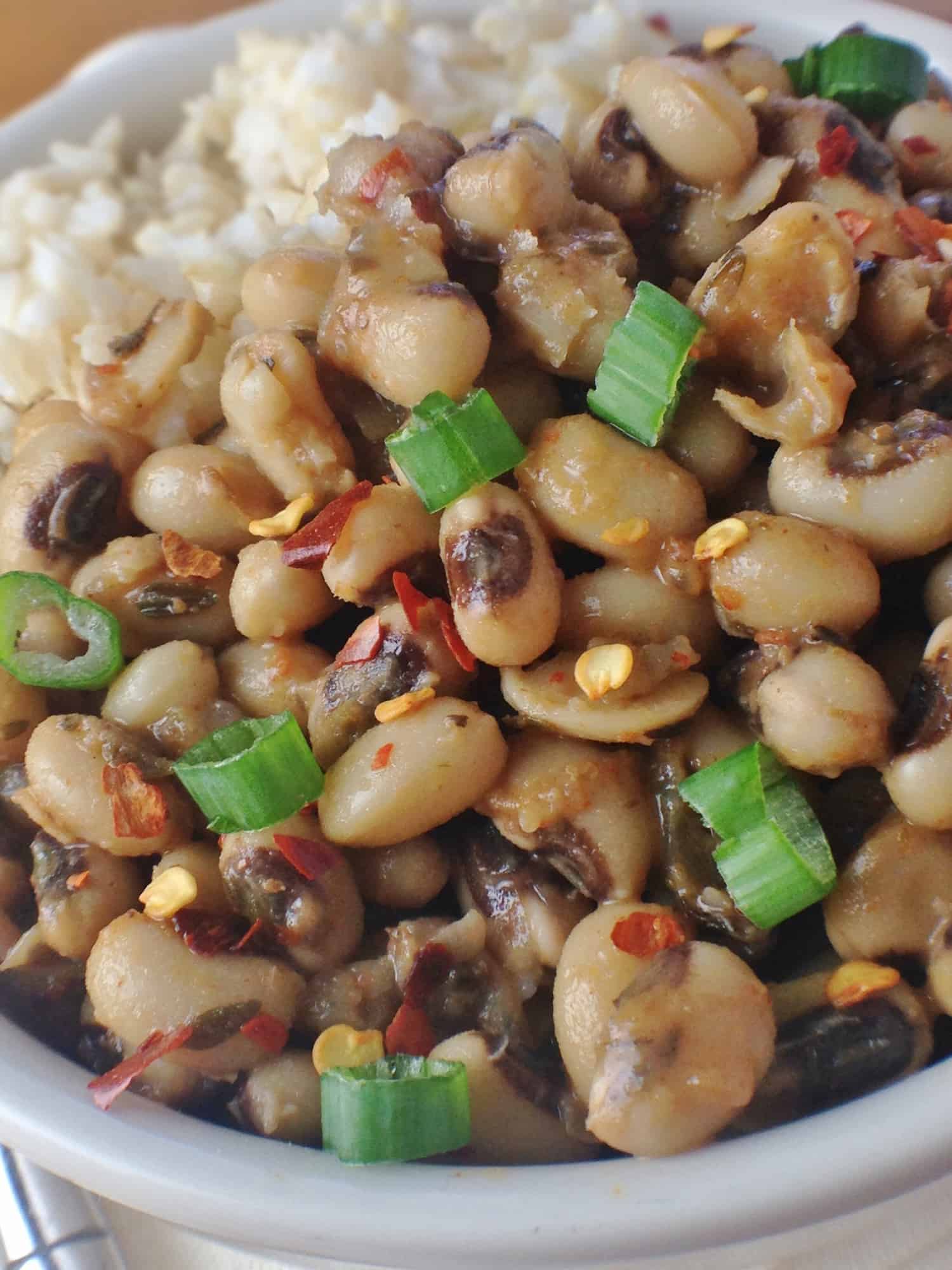 closeup of ne years black eyed peas in a bowl with green onions