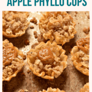 apple pie filling in a phyllo cup with caramel and streusel topping.