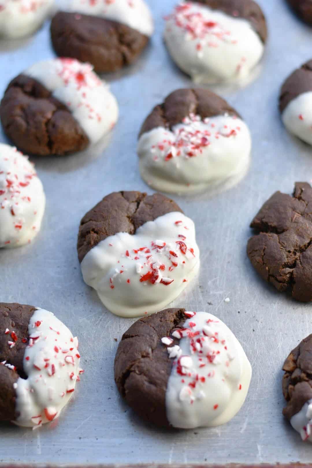 chocolate candy cane cookies on a cookie sheet