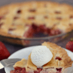 closeup of strawberry rhubarb pie with ice cream