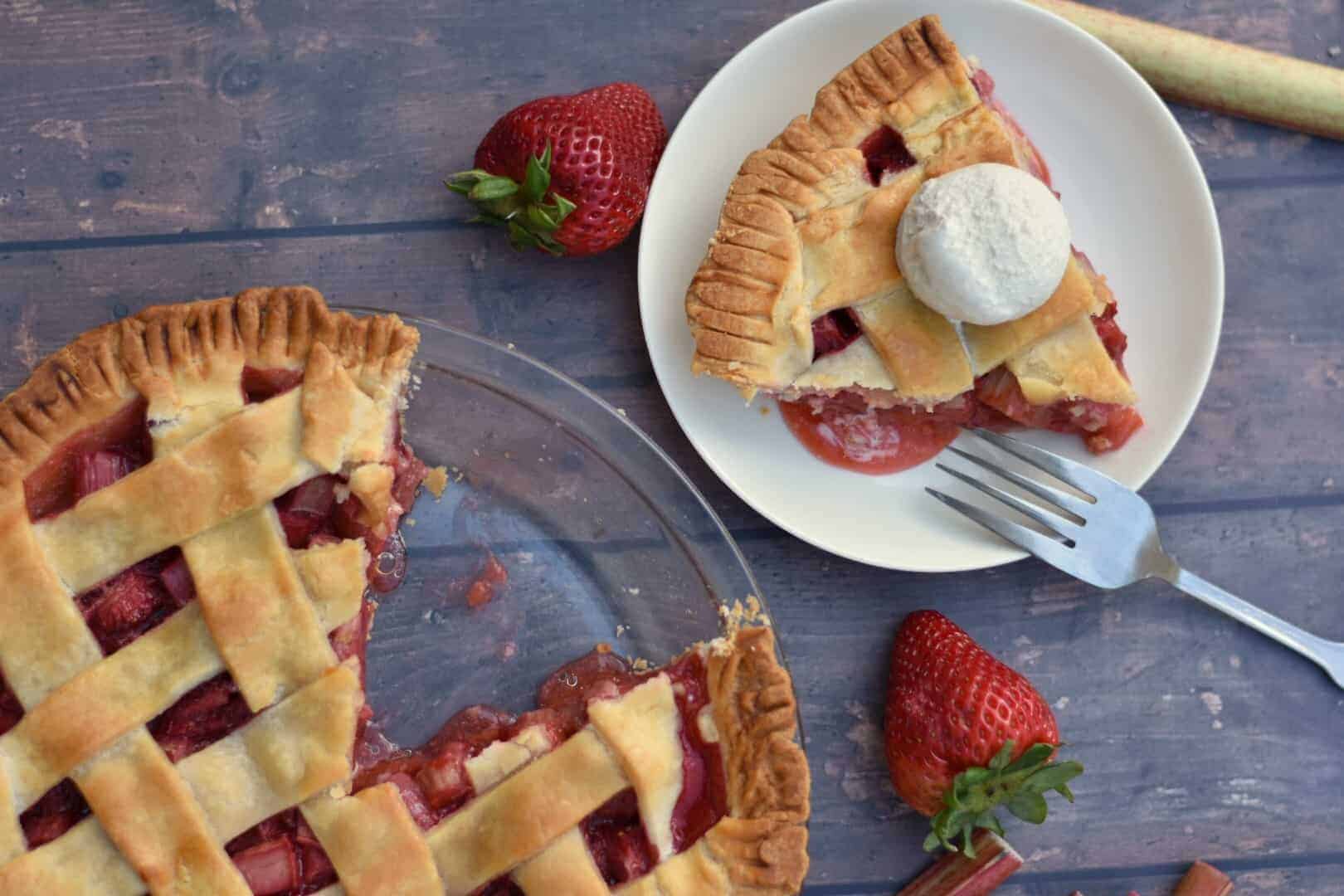 slice of strawberry rhubarb pie with ice cream