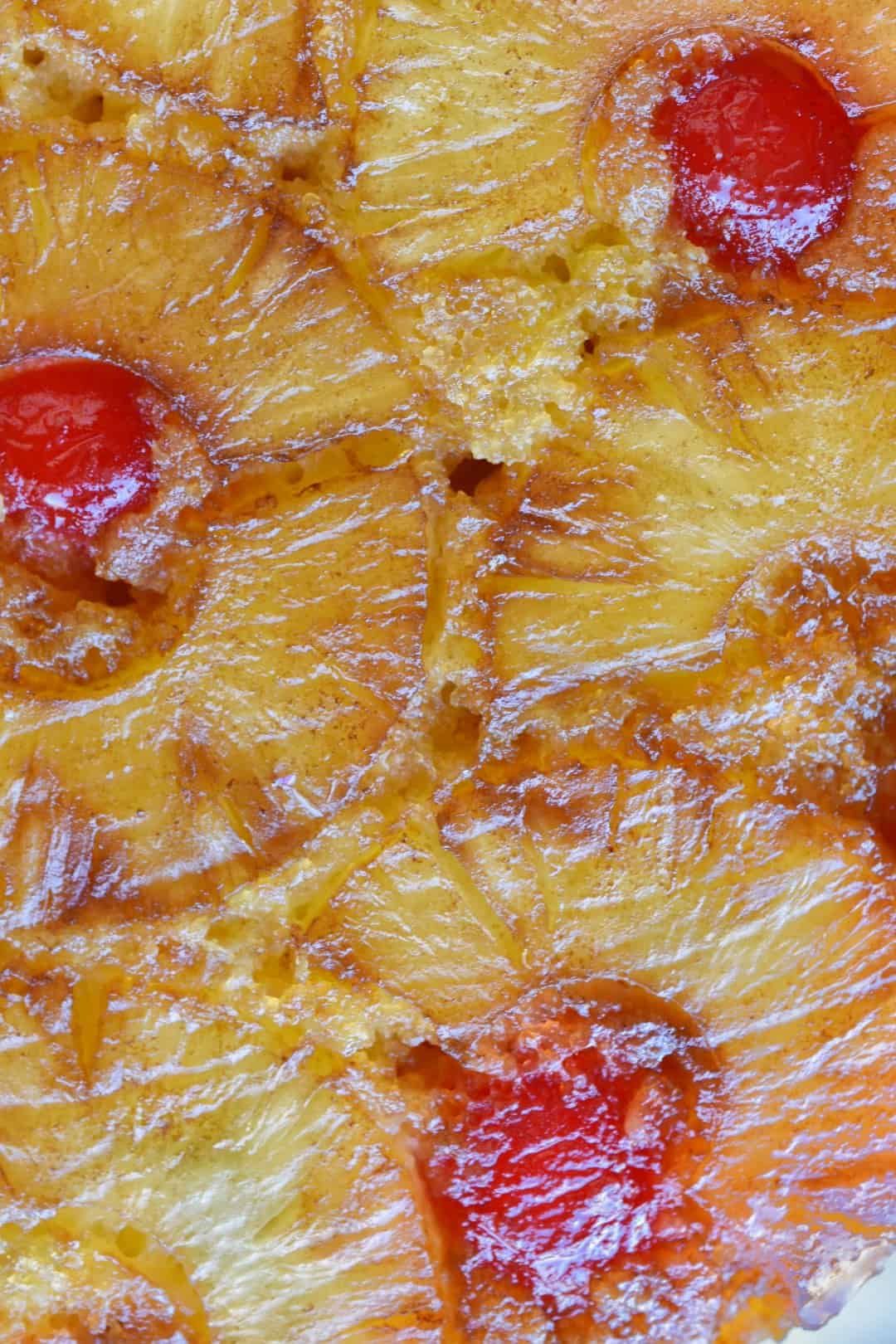 close up of pineapples on a baked pineapple upside down cake