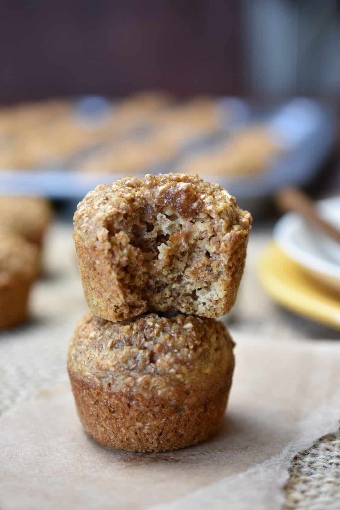closeup of two miniature bran muffins stacked on top of each other