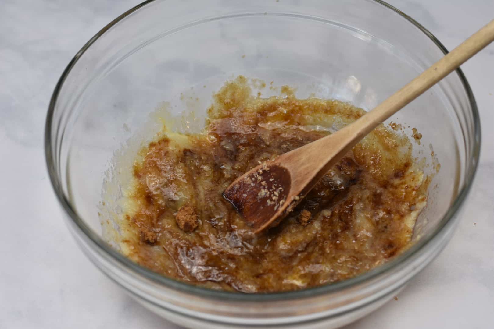 bowl with wet ingredients of applesauce, brown sugar, and egg