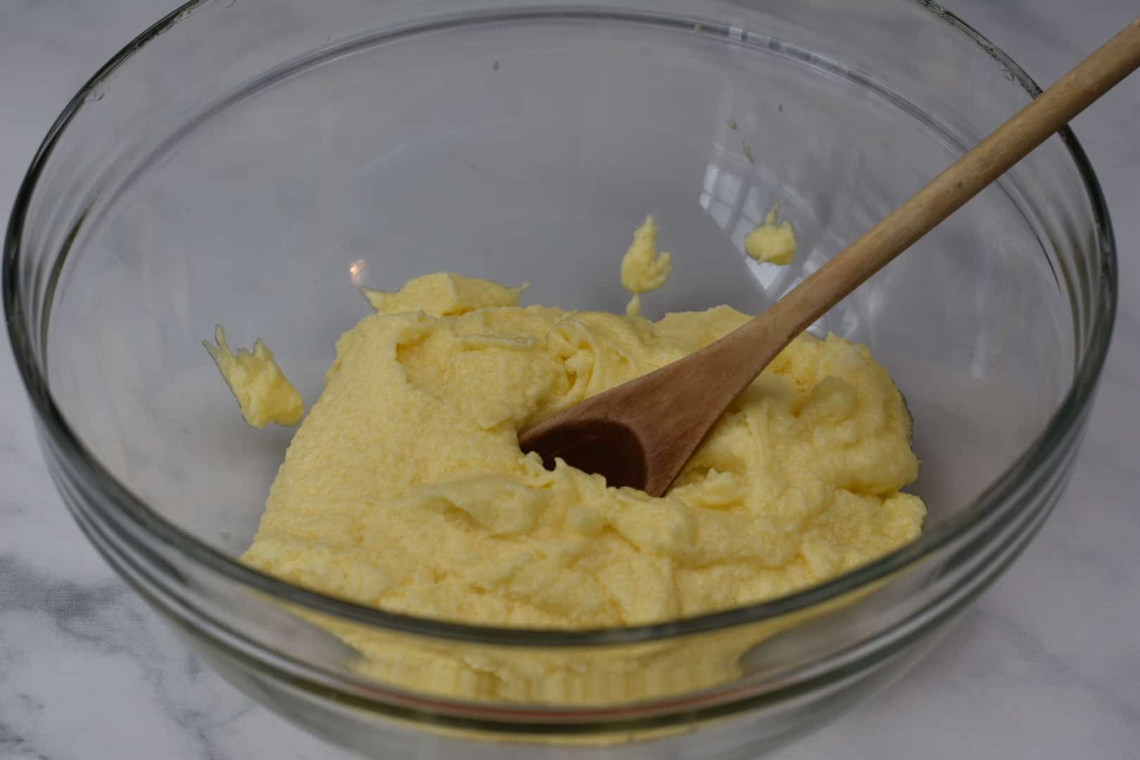 butter, sugar, and eggs in a glass bowl