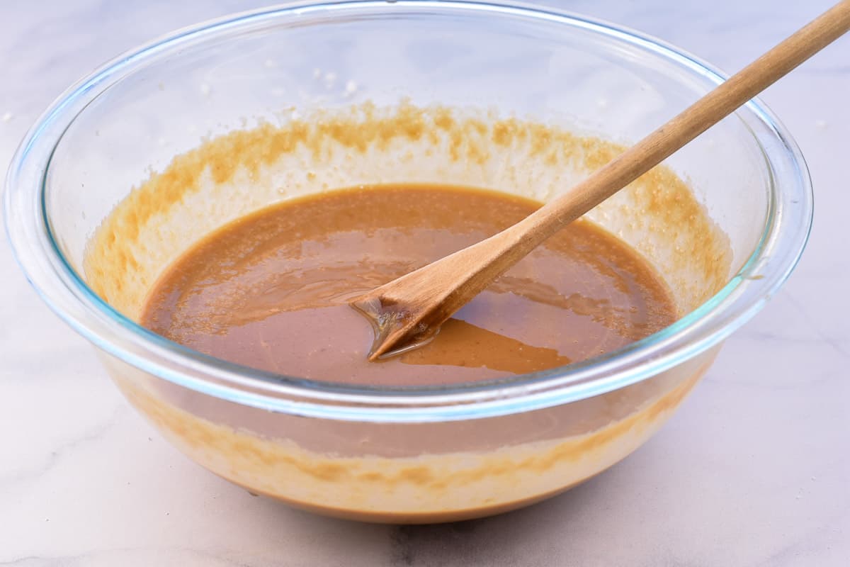 melted peanut butter and butter in glass bowl