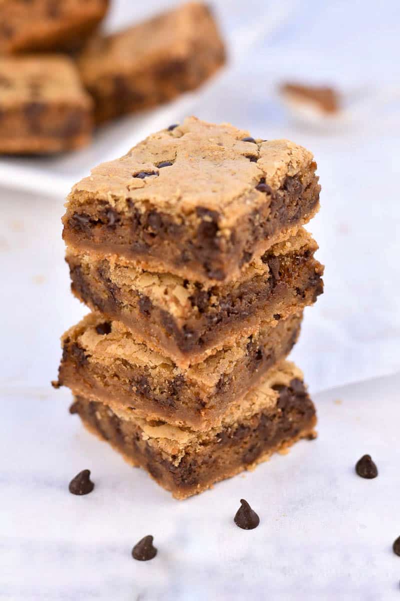 chocolate chip cookie butter blondies stacked on top of each other