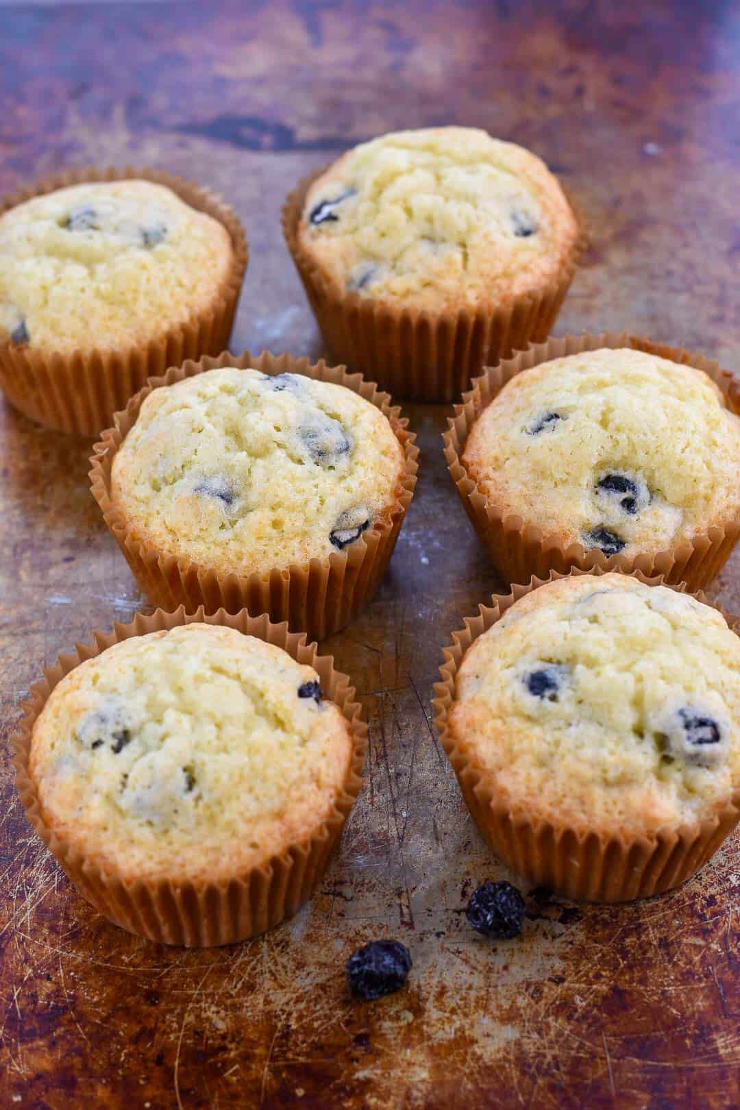 jiffy blueberry muffin copycat recipe sitting on a baking sheet