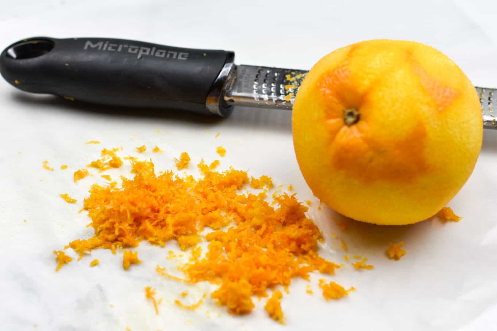 orange with zest and zester