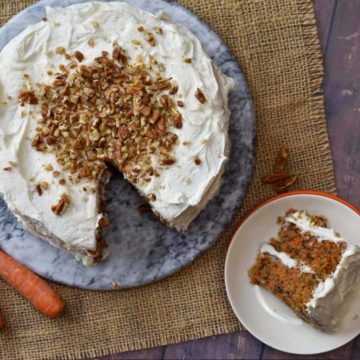 overhead shot of pecan carrot cake with a slice on a plate