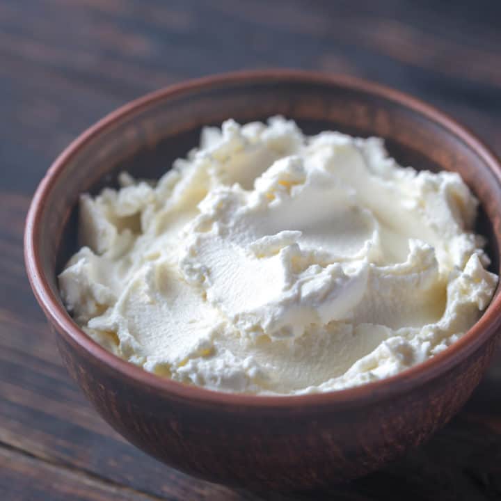 cream cheese spread in a wooden bowl.