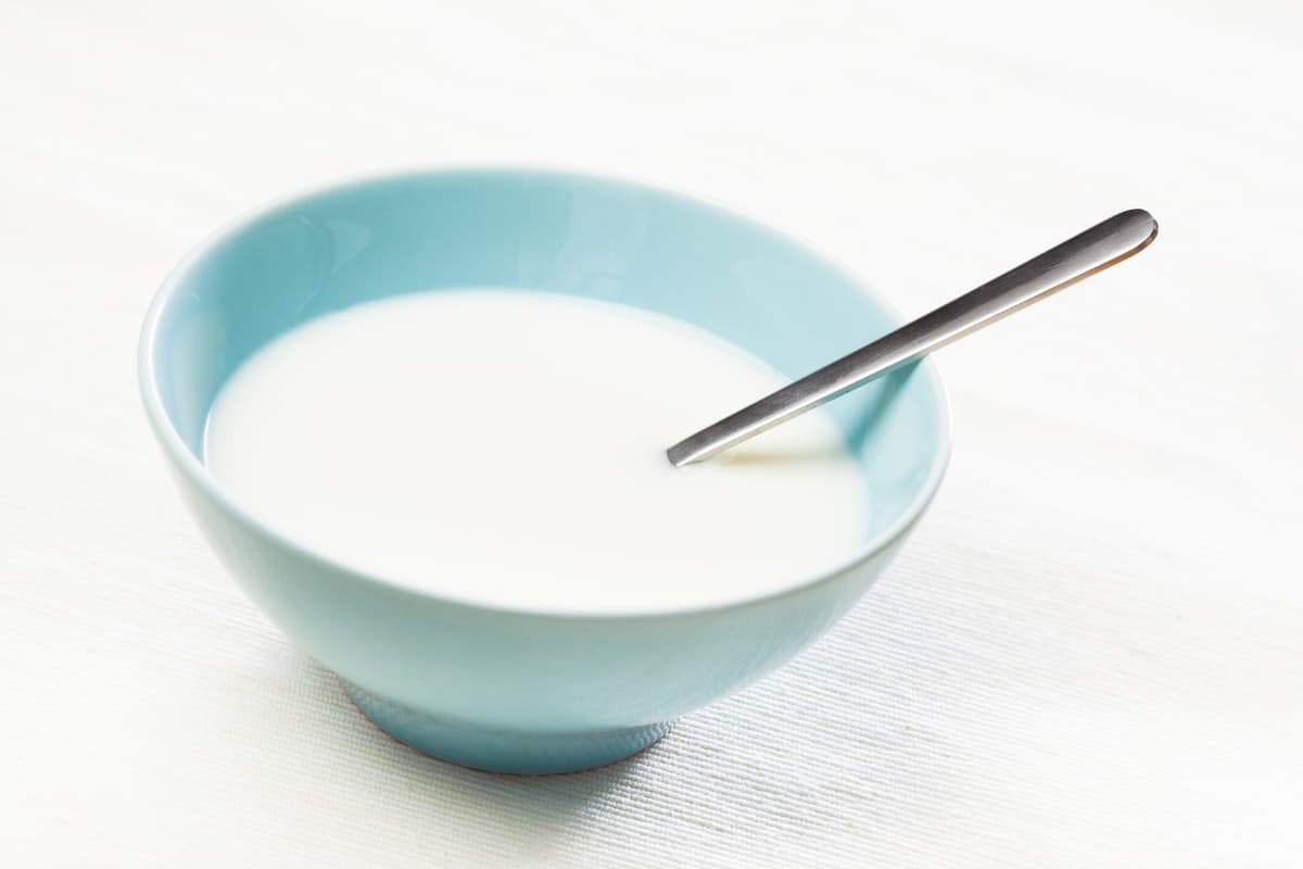 heavy cream in a blue bowl