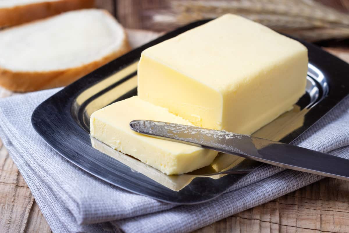 large block of butter sitting on a plate