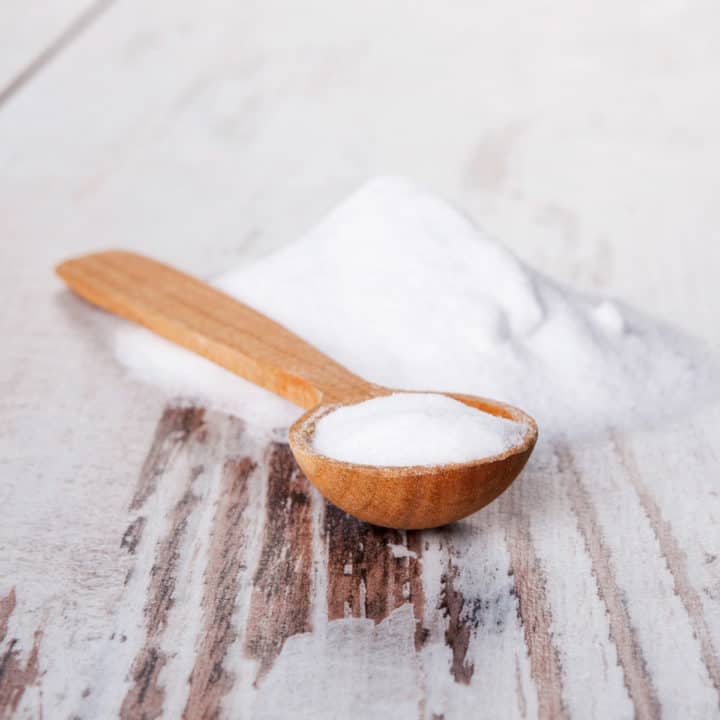 wooden spoon on counter filled with baking soda