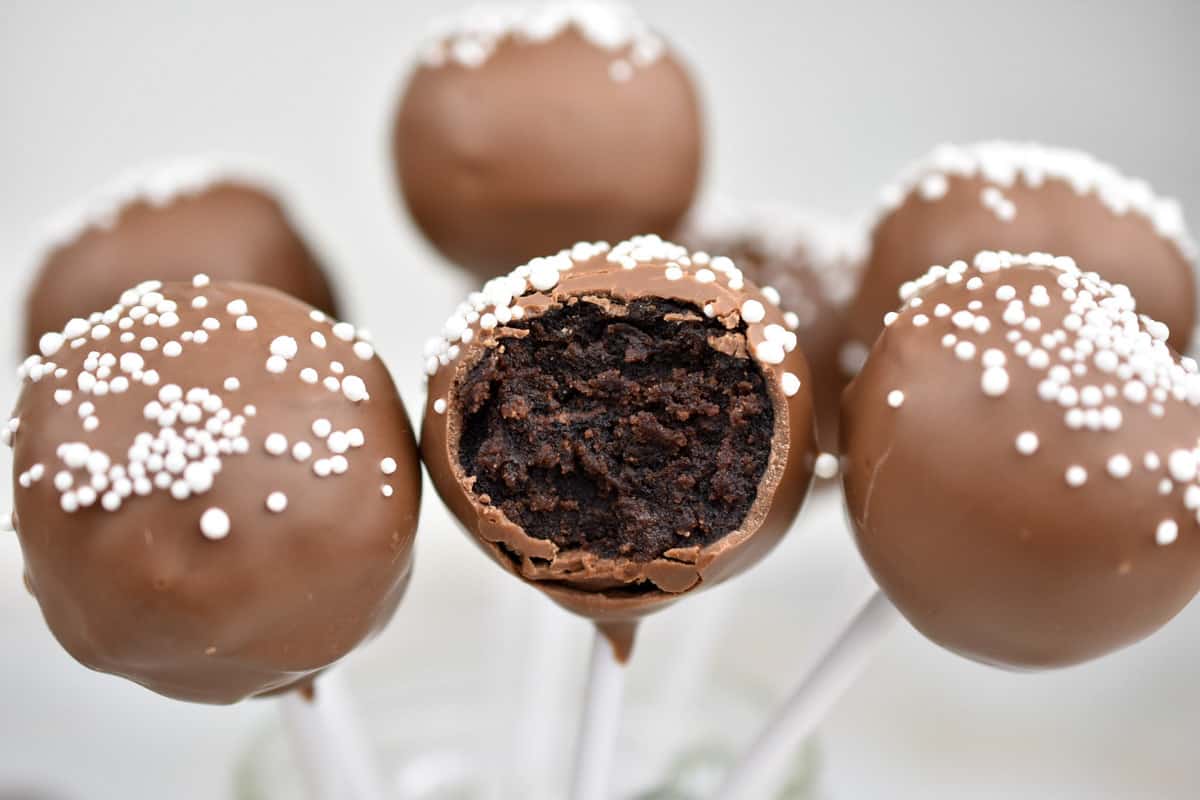 several Starbucks chocolate cake pops in a glass