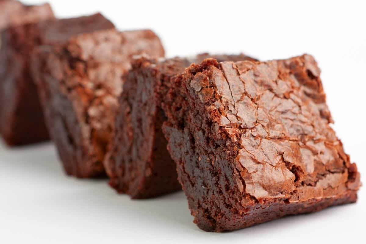 closeup of up brownies on a white table