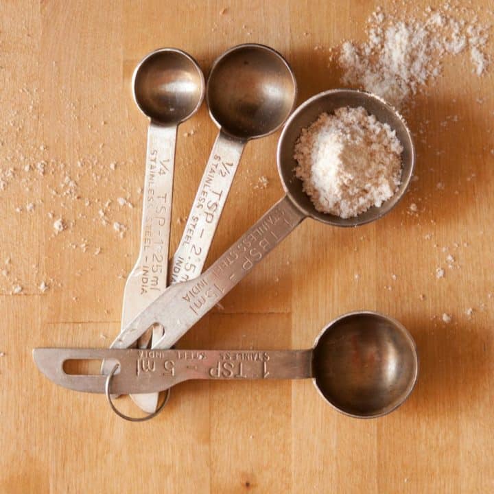 measuring spoons on wooden counter