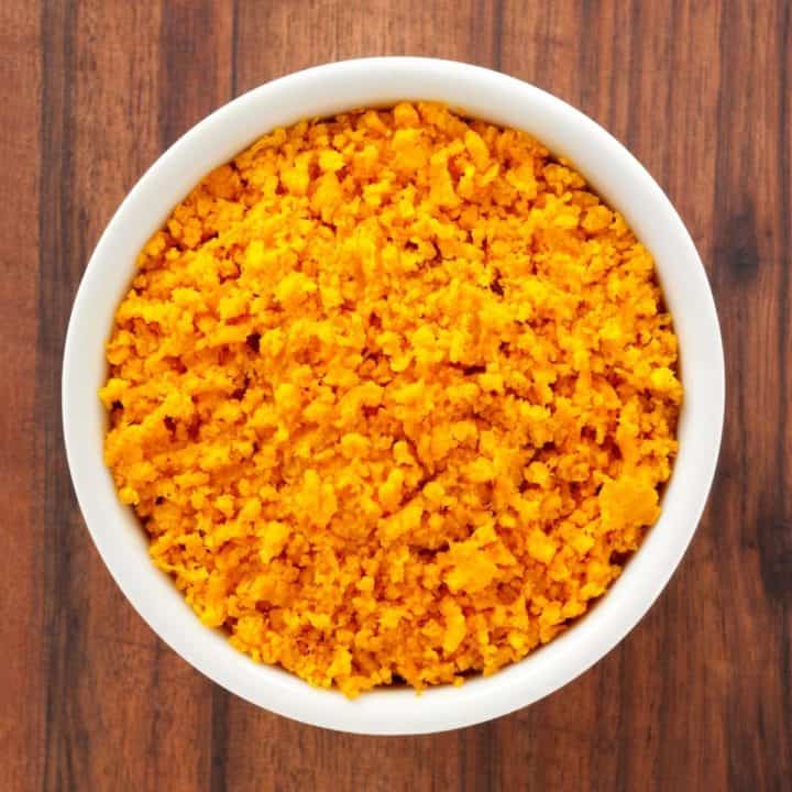 orange zest in a white bowl.