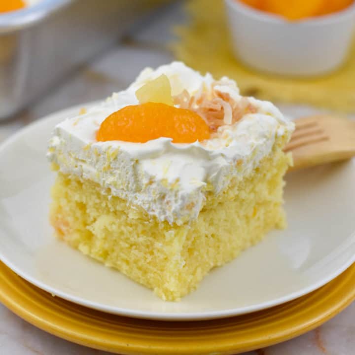 slice of pig pickin-cake with mandarin orange garnish.