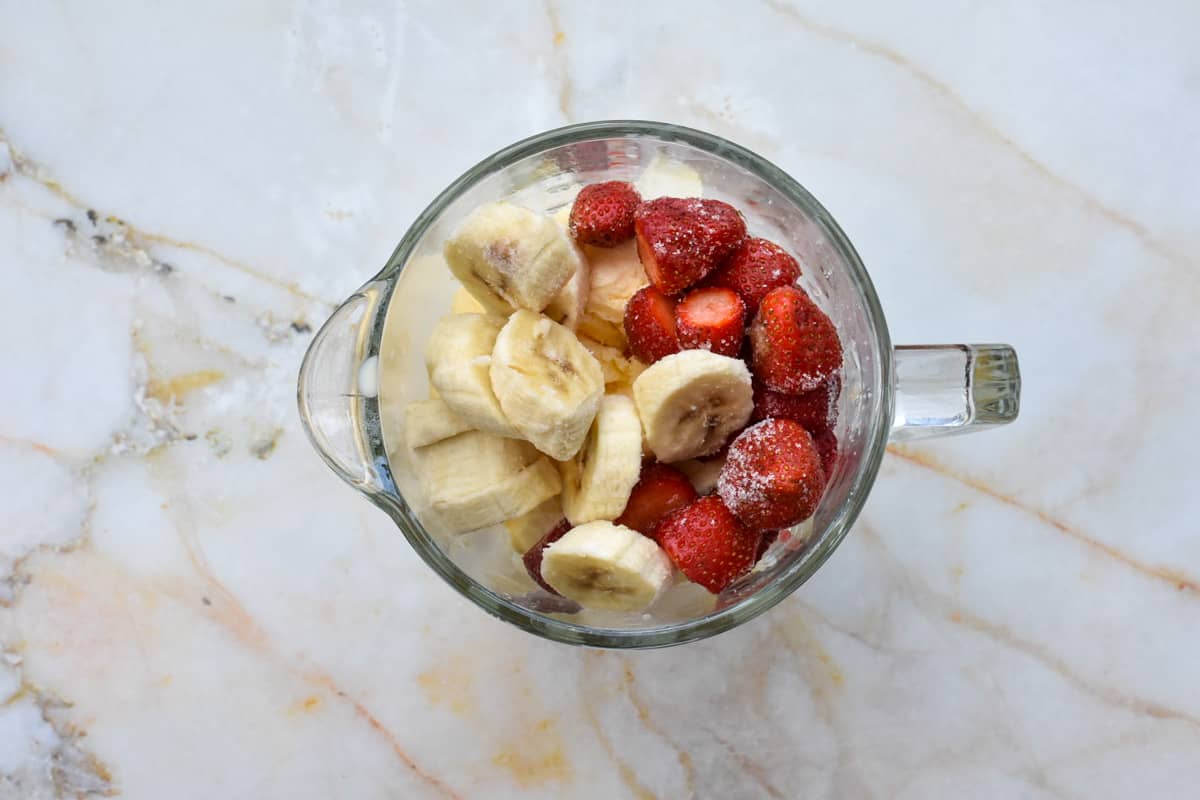 strawberries and banana in a blender. 
