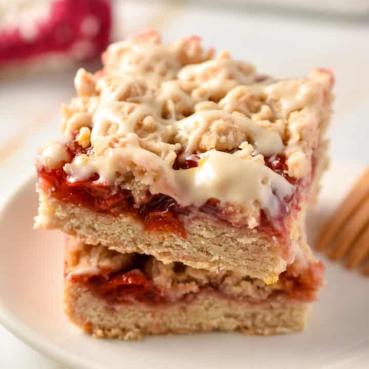 two bars of cherry coffee cake stacked on top of each other.