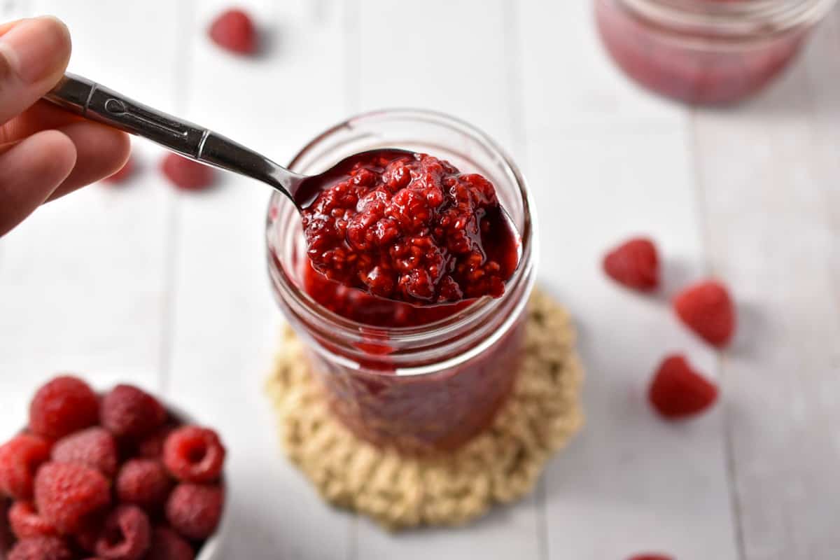 raspberry compote in a spoon.