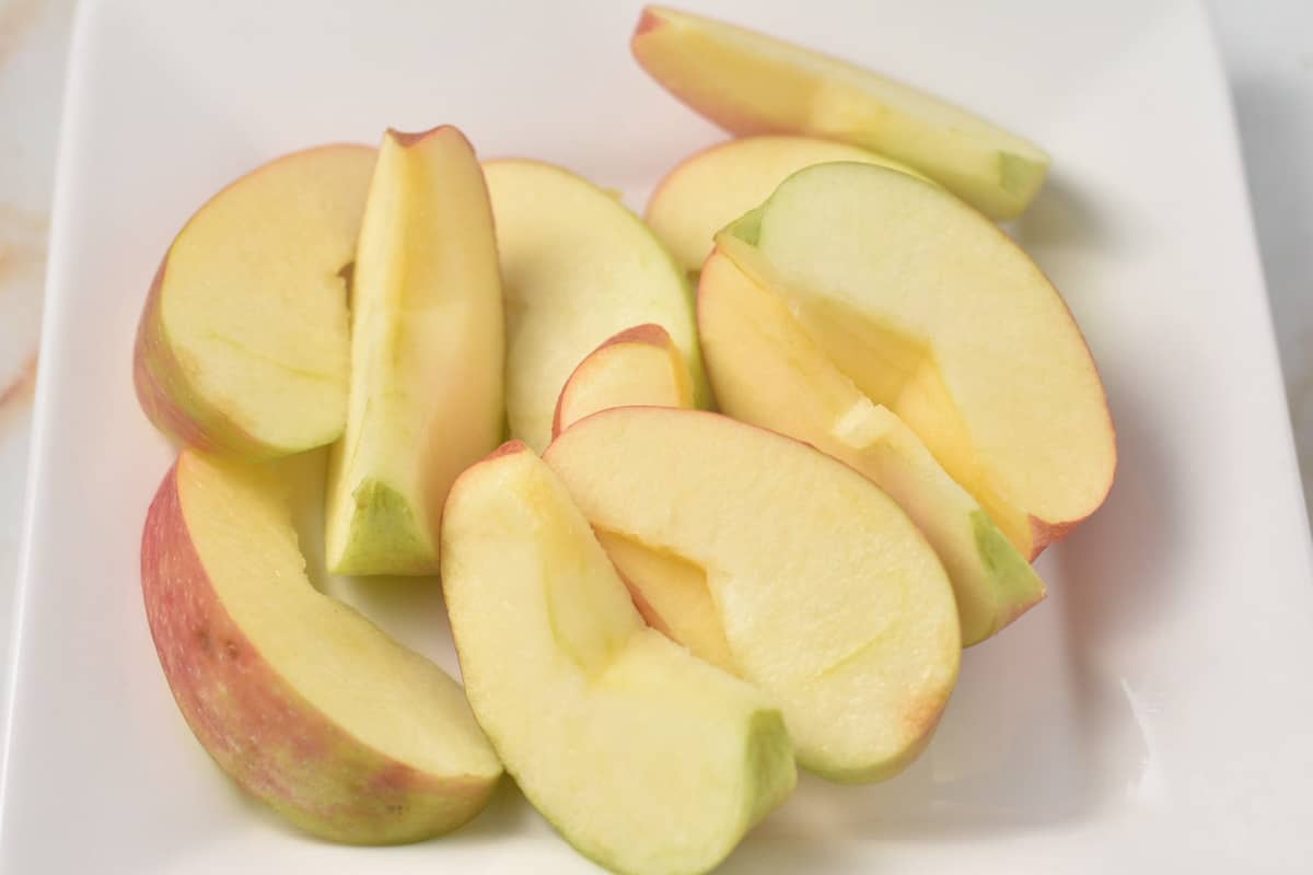 cut apple slices on a white plate.