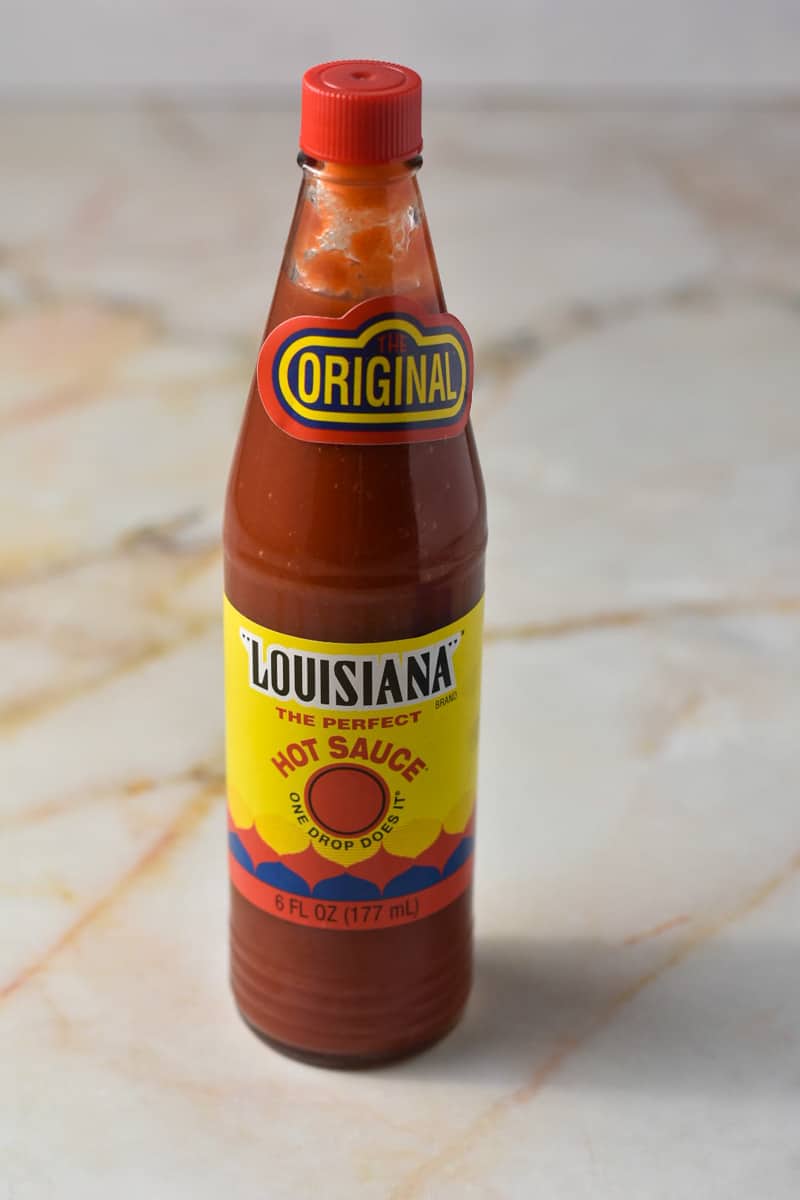 jar of Louisiana hot sauce unopened on the counter. 