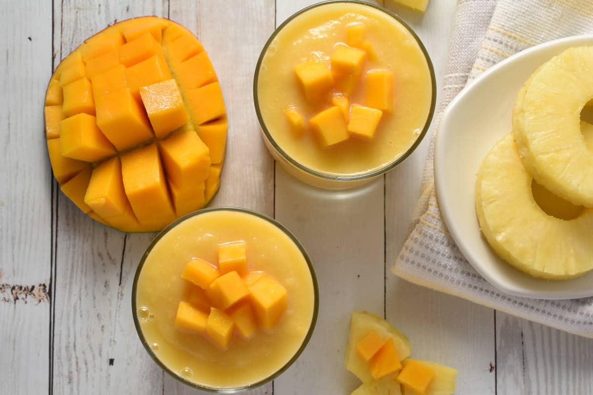 A sweet and tangy Mango-a-Go-Go Smoothie embellished with pineapple and mango chunks.