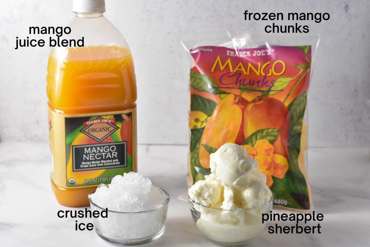 all mango smoothie ingredients sitting on a counter and labeled. 