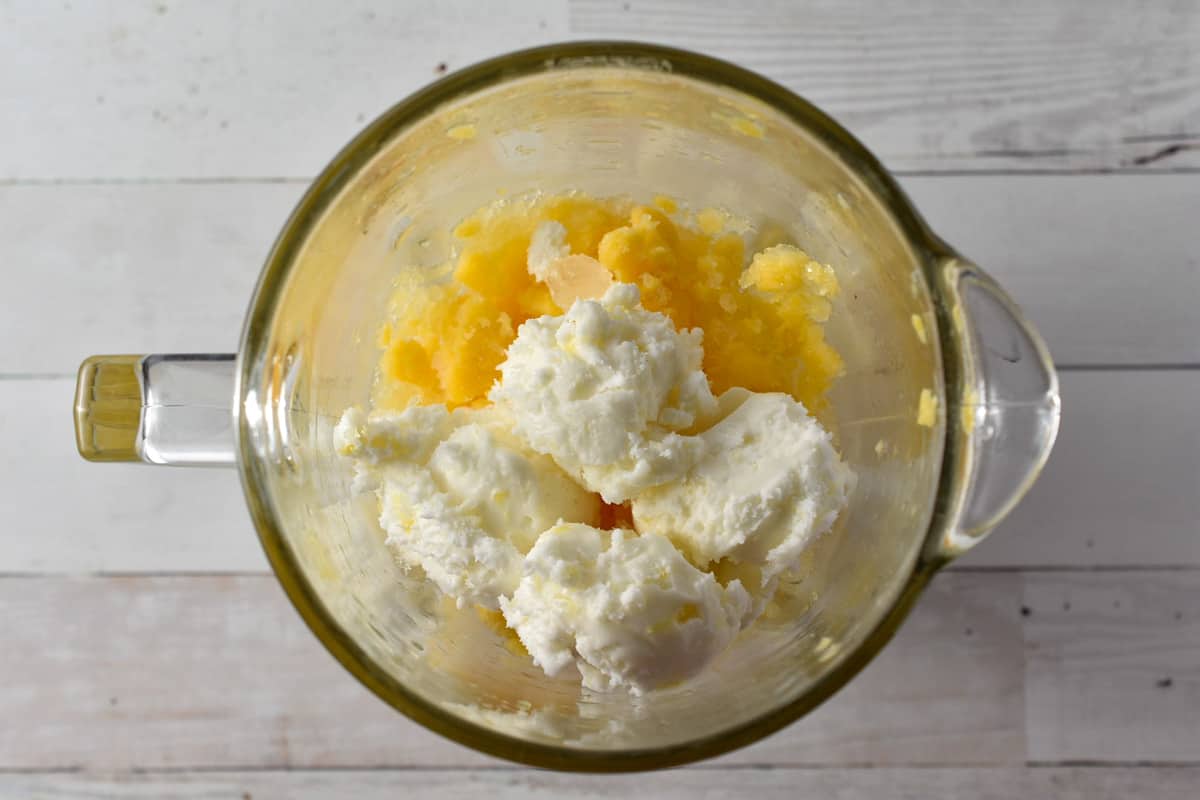 crushed mango and ice cubes in a blender with pineapple sherbert. 