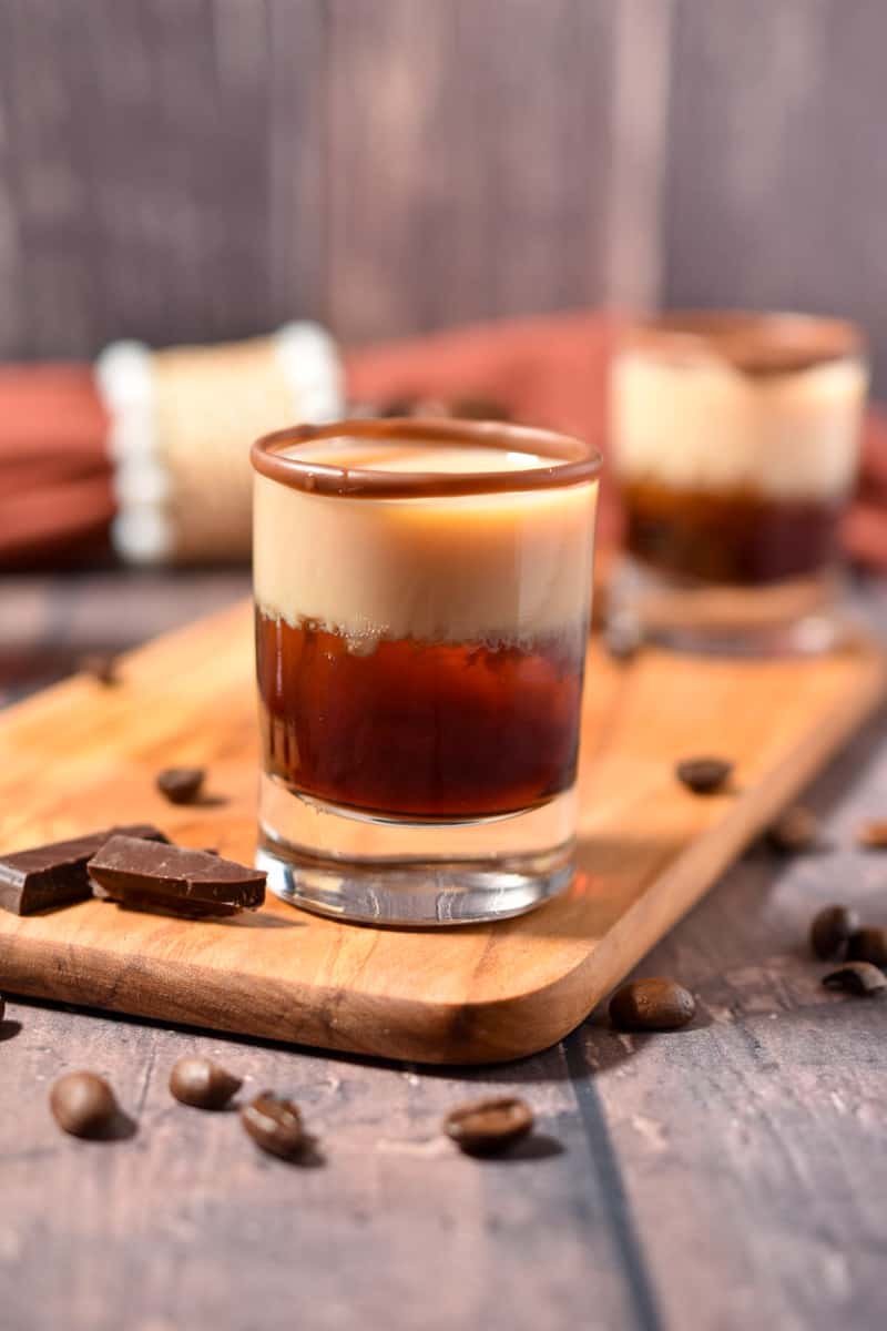 Irish creme layered in shot glass with coffee liqueur