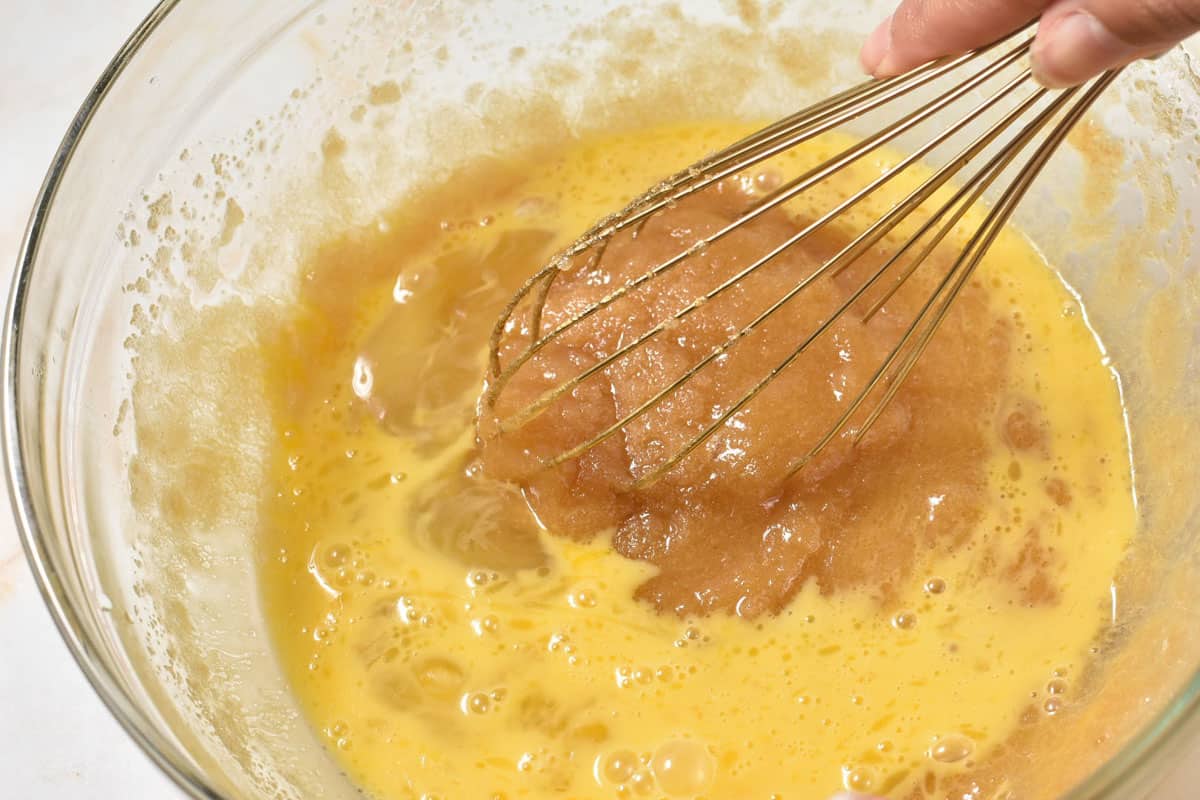 mixing bowl with sugar, eggs, and vanilla with a whisk. 