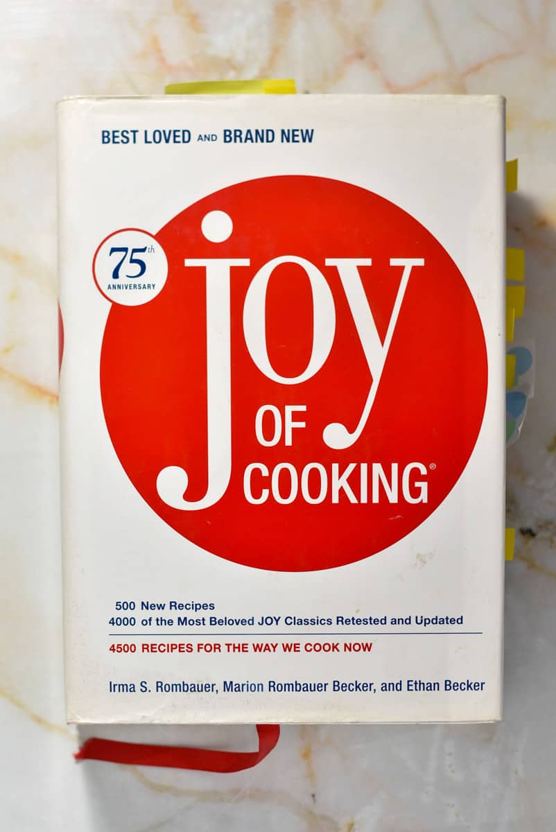 joy of cooking cookbook sitting on a counter. 