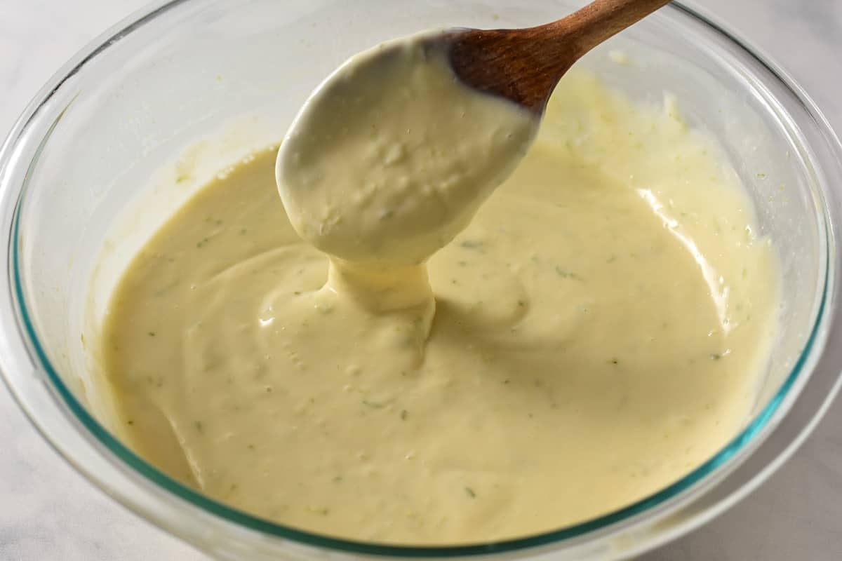 a spoon mixing the key lime pie filling together.