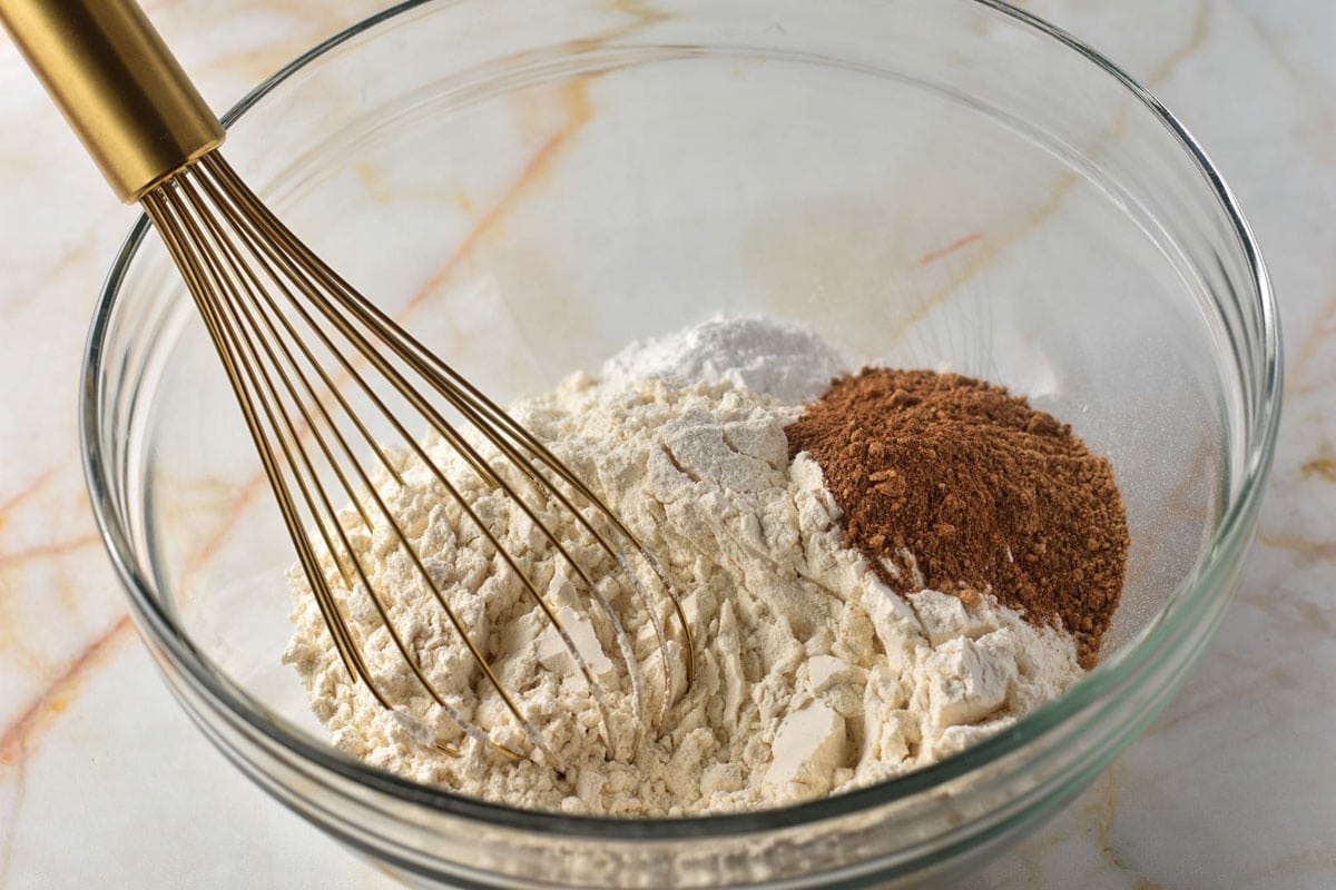 flour, spice mixture, and baking soda in a bowl with whisk. 