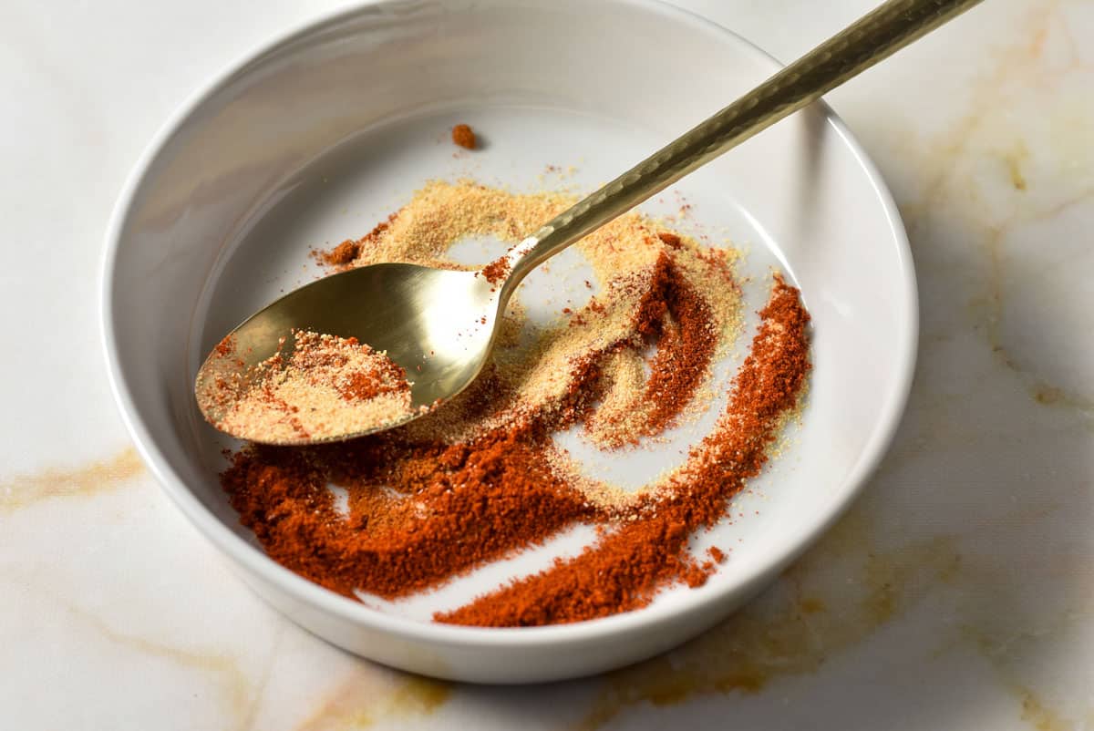 spices mixed in a bowl for ranch dressing. 