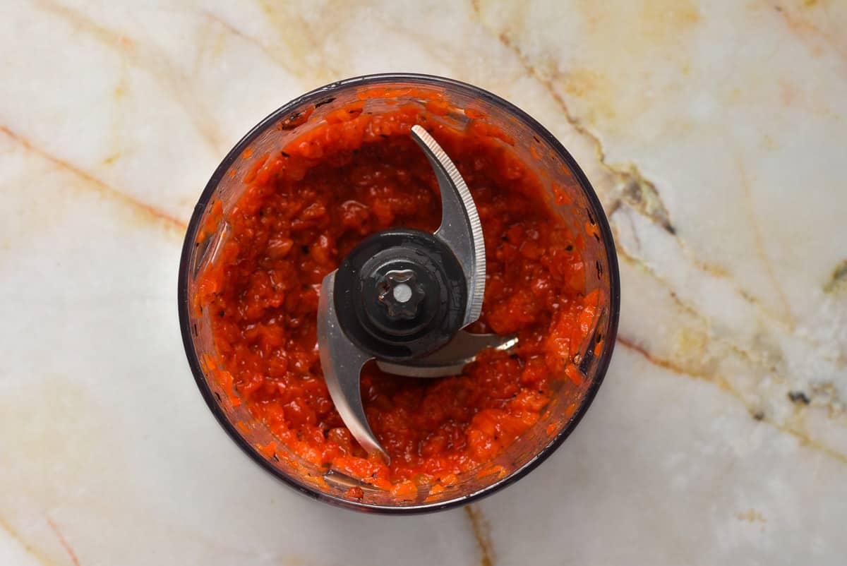 drained roasted bell peppers in a blender. 
