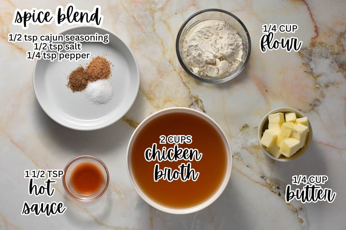 a countertop with individual bowls of chicken broth, flour, butter, hot sauce, and cajun seasoning.
