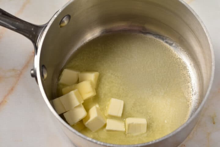 a pot with cubes of melted butter.
