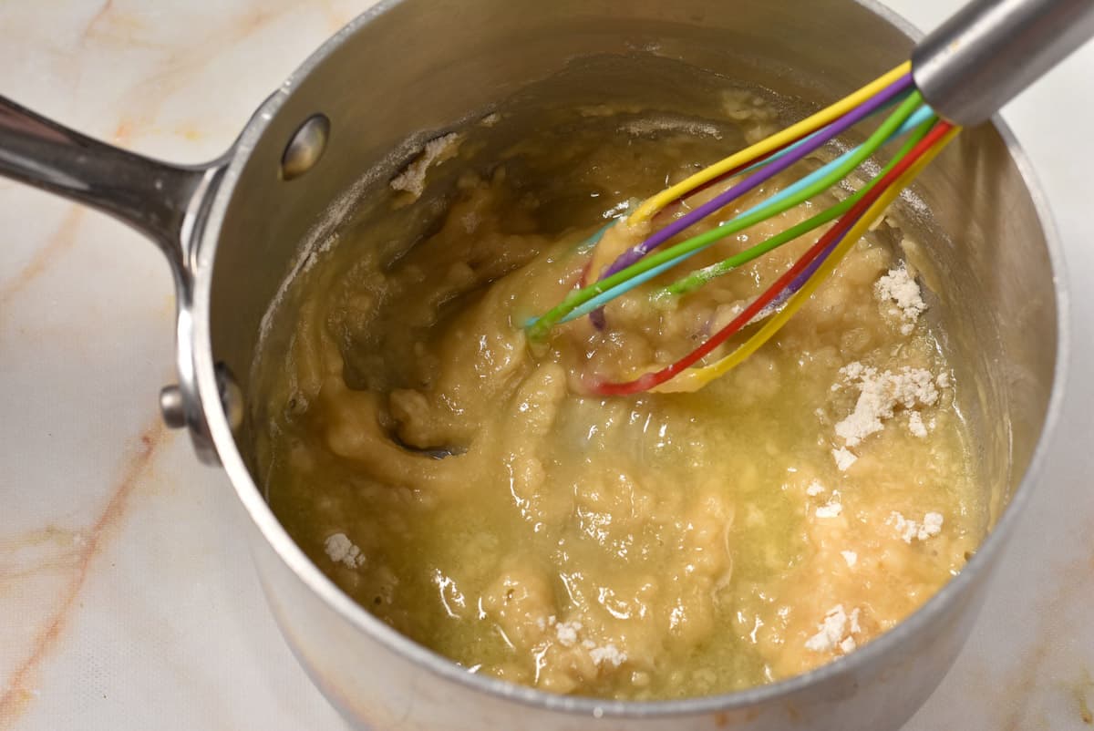 roux whisked in a pan on the stove