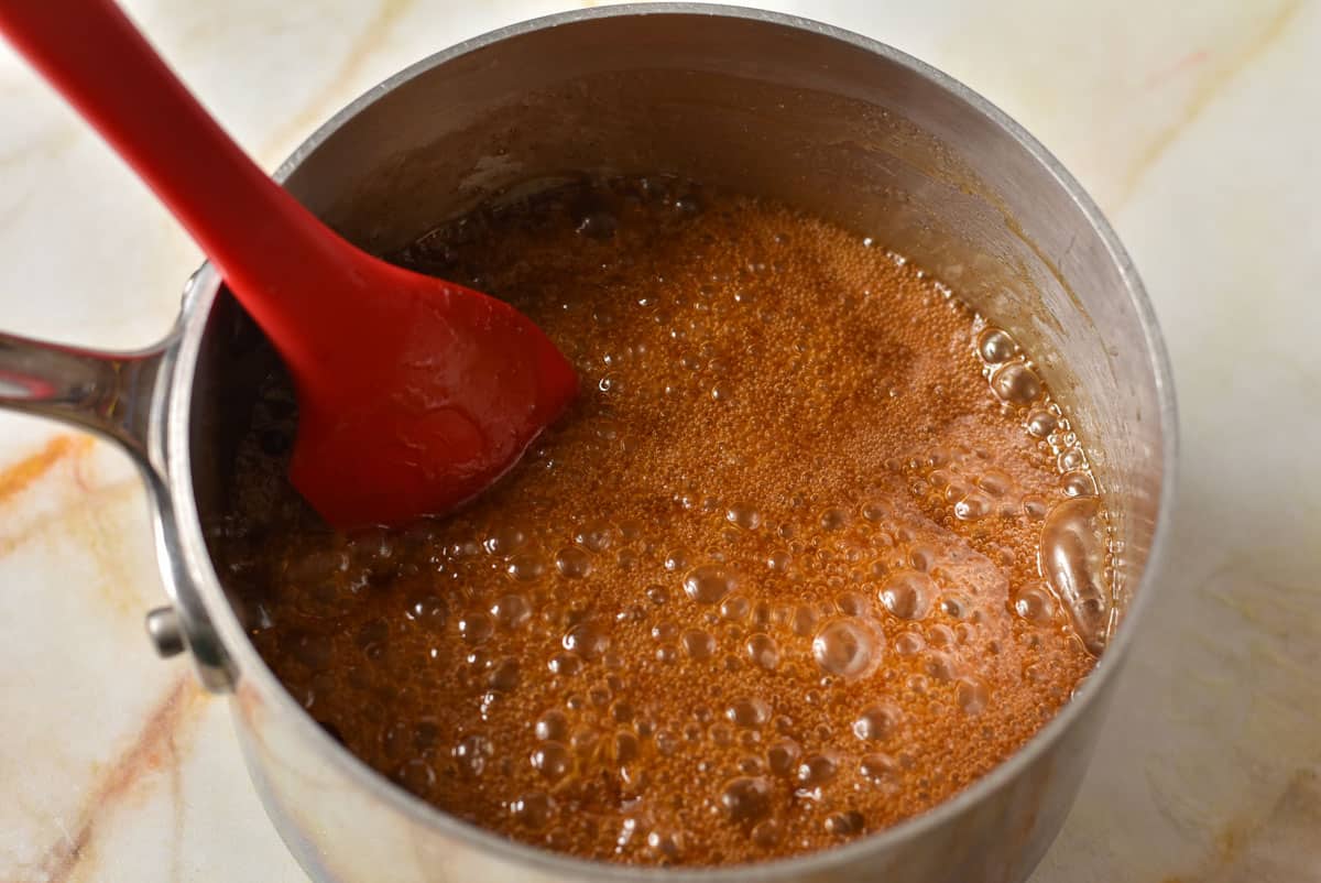 glaze mixture bubbling in a pan being cooked. 