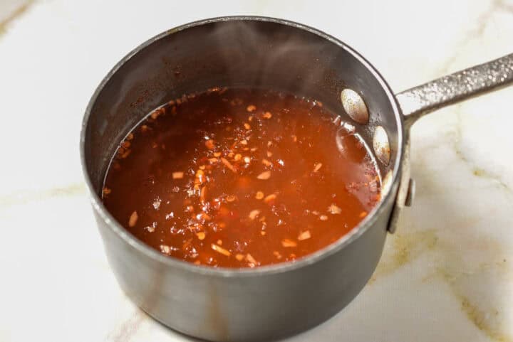 process shot of ingredients simmering on the stove.