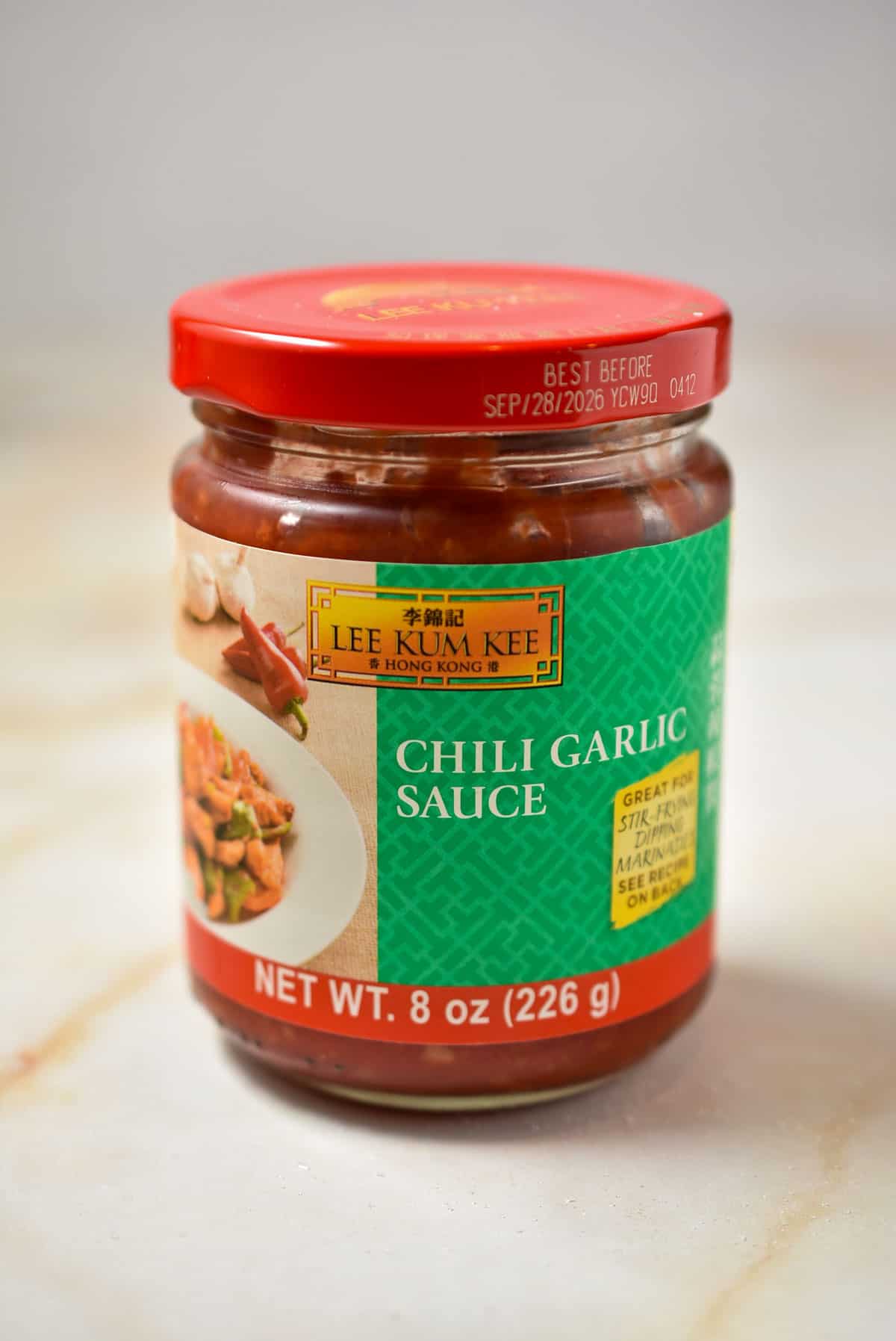 container of chili garlic sauce.