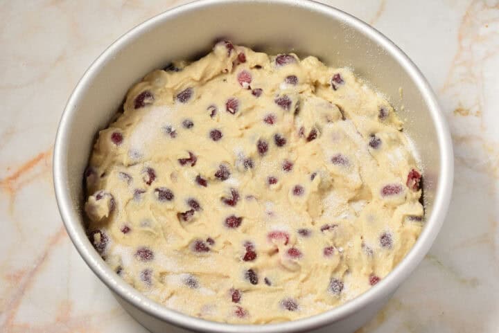 process shot of dough in pan with sugar sprinkled on top.