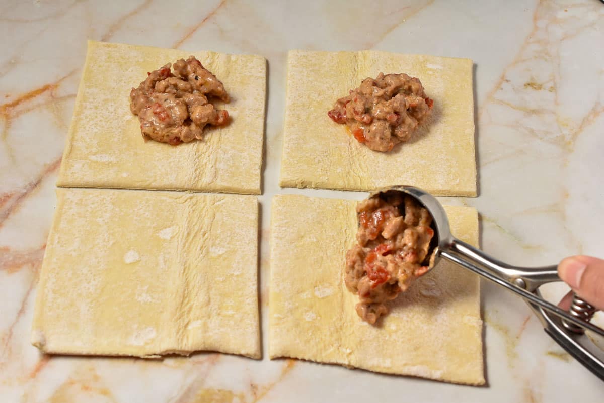 scooping filling into puff pastry.