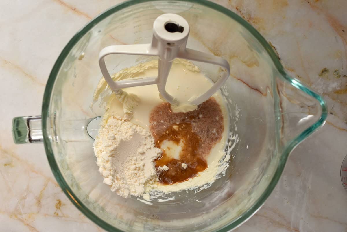pastry cream mix with milk and vanilla in a stand mixer.