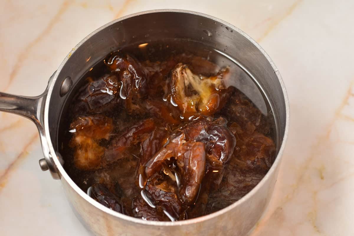 dates and water in a pan on the counter.